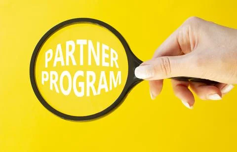 Partner Program symbol. Concept words Partner Program on magnifying glass. .. Stock Photos