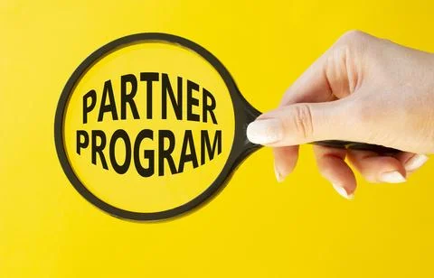 Partner Program symbol. Concept words Partner Program on magnifying glass. .. Stock Photos
