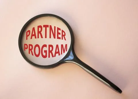 Partner Program symbol. Concept words Partner Program on magnifying glass. .. Stock Photos