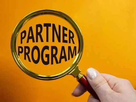 Partner Program symbol. Concept words Partner Program on magnifying glass. .. Stock Photos