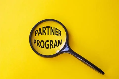 Partner Program symbol. Concept words Partner Program on magnifying glass. .. Stock Photos