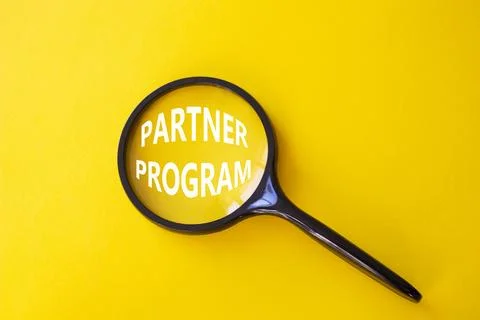 Partner Program symbol. Concept words Partner Program on magnifying glass. .. Stock Photos
