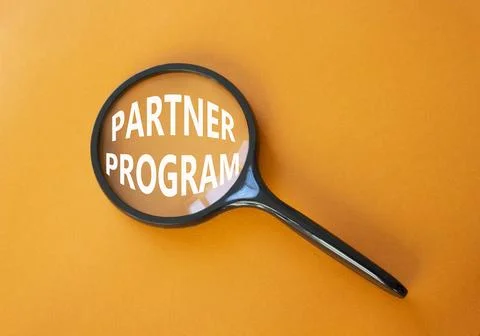 Partner Program symbol. Concept words Partner Program on magnifying glass. .. Stock Photos