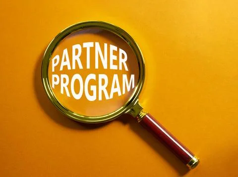 Partner Program symbol. Concept words Partner Program on magnifying glass. .. Stock Photos