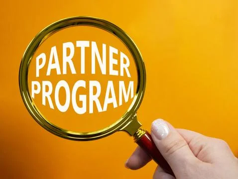 Partner Program symbol. Concept words Partner Program on magnifying glass. .. Stock Photos