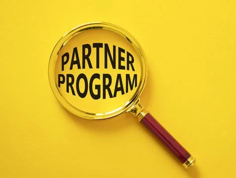 Partner Program symbol. Concept words Partner Program on magnifying glass. .. Stock Photos