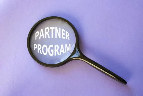 Partner Program symbol. Concept words Partner Program on magnifying glass. .. Stock Photos