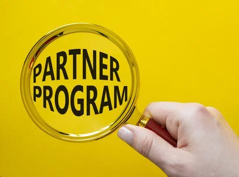Partner Program symbol. Concept words Partner Program on magnifying glass. .. Stock Photos