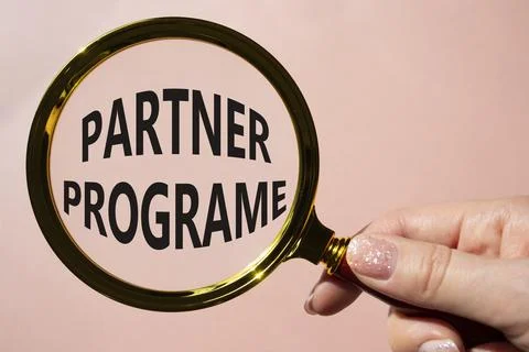 Partner Program symbol. Concept words Partner Program on magnifying glass. .. Stock Photos