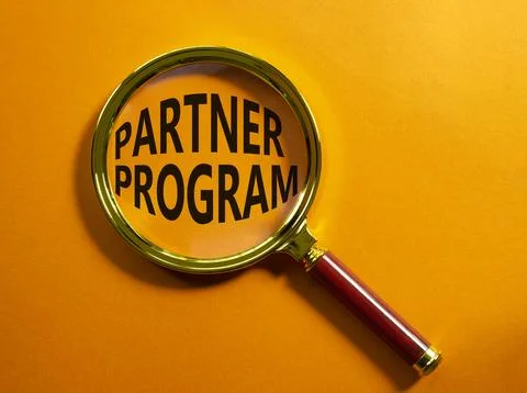 Partner Program symbol. Concept words Partner Program on magnifying glass. .. Stock Photos