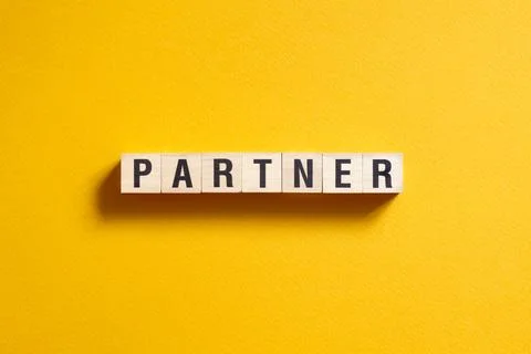 Partner - word concept on cubes, text, letters Stock Photos