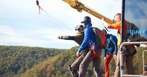 Partners Base Jumping Off Bridge, Parachute Pull, Slow Motion Stock Footage 127466862