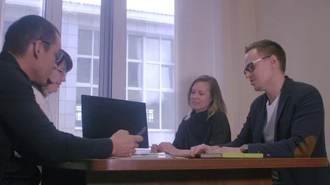 Partners discussing business plan Stock Footage 82579922