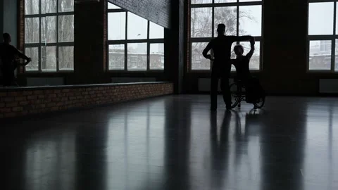 Partners, one with disability, dancing in ballroom Stock Footage 157918118