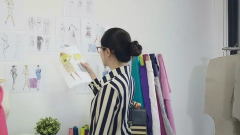 Partners in studio discussing on new collection Stock Footage 118032358