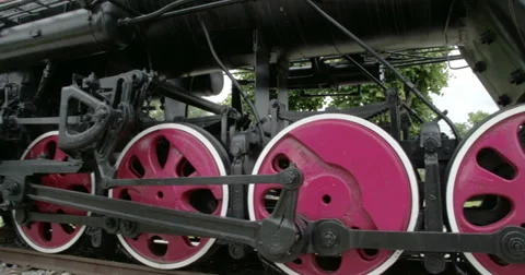 The parts of the wheels of the locomotive train fs700 4k raw odyssey 7q Stock Footage