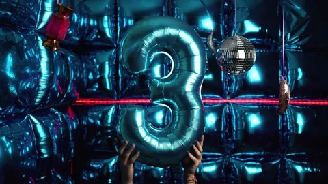 Party Background with Number 3 Foil Balloon, Disco Balls, and Lights Stock Footage 306675636