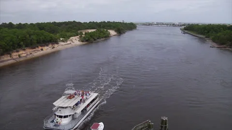 Party barge glides under bridge on waterway b, ship passes, 60fps Stock Footage 24418687
