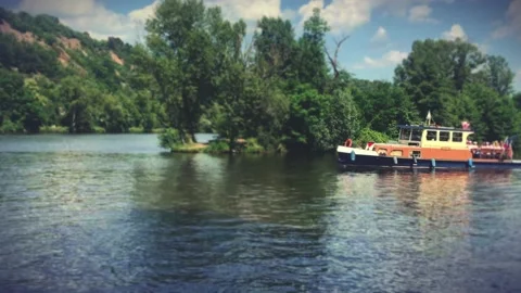 Party boat navigating river Stock Footage 134833272