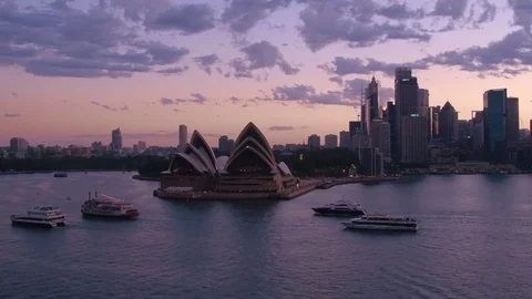 Party boats on Sydney Harbour at sunset Stock Footage