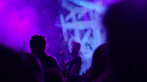 Party crowd / Silhouettes in front of DJ stage Stock Footage 65745964