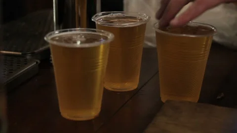 Party hard! Man buying lot of glasses beer. Friends come together to celebrate Stock Footage