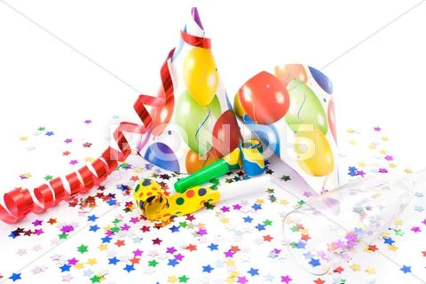 Party hats, horns or whistles and confettis on white background. Stock Photos