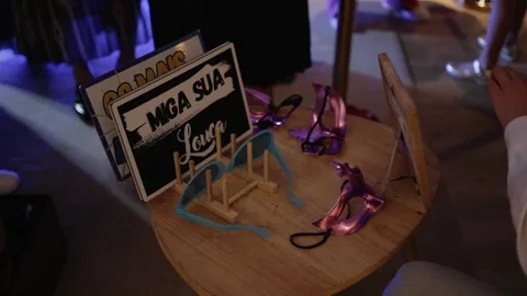 Party props table with signs and masks Stock Footage 306757329