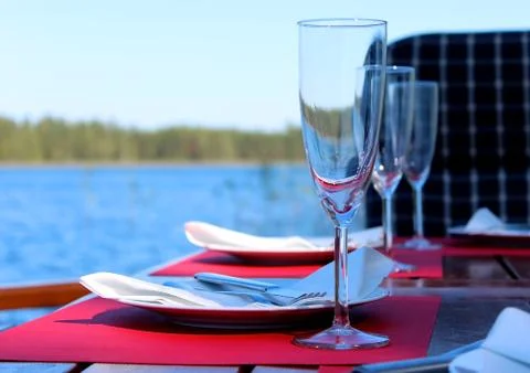 Party table by the water. Stock Photos