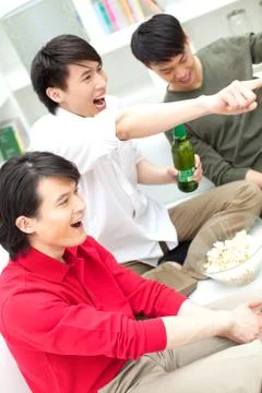 A party of three men Stock Photos