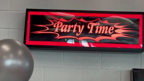Party Time red and black electric light up sign and balloons for kids Stock Footage 225849791