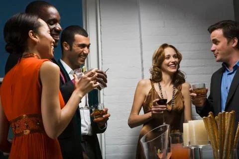Partygoers socializing Stock Photos