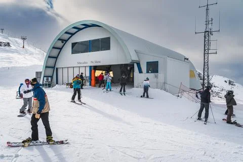 Pas de la Casa, Andorra, Jan 2020 Skiers and snowboarders exiting ski lift on Stock Photos