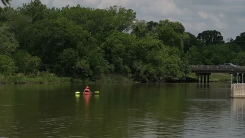 Pasadena, TX, US - June 05, 2022: Kayaker drifts up Armand Bayou Stock-Footage 196672310