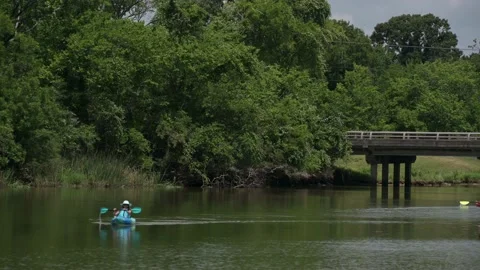 Pasadena, TX, US - June 05, 2022: A female Kayaker paddles down Armand Bayou. Stock-Footage 196770460