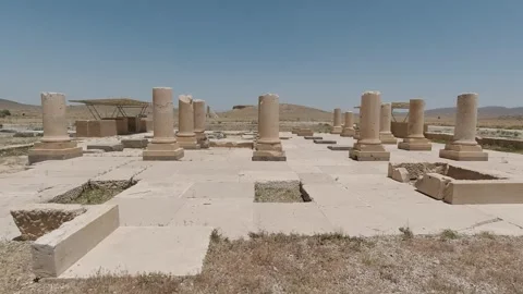 Pasargadae stone columns and palace foundations under midday sky Stock Footage 320273824