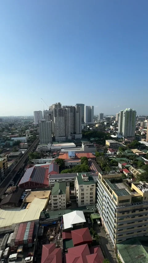Pasay City Skyline High Angle Panning Shot LRT 1 Tracks Manila 4K 60fps Stock Footage 338185606