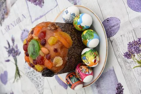 Pasca, Easter cake with painted eggs Stock Photos