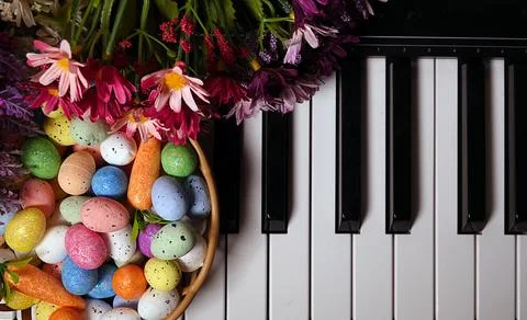 Paschal Easter Eggs and Piano Keys and Flowers Stock Photos