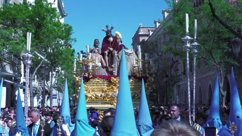 Paso and Blue Capirotes During Holy Week Procession in Seville Stock Footage 336025133
