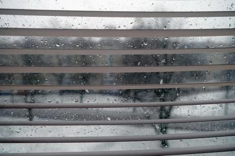 Pass of the camera from below in top at a window. Focus on window. Stock Photos