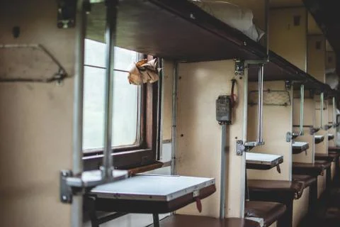Pass in old abandoned soviet train car. Places for passangers Foto stock