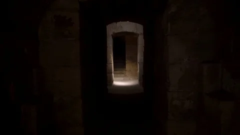 Pass through a long and dark Roman basement. Basement under the Amphitheater in Video stock 120305764