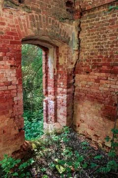 Passage in the ancient wall. Stock Photos