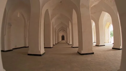 Passage between columns and arches in the Mir-i-Arab Madrasa complex. Stock Footage 256643241