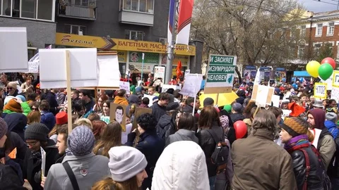 Passage of the camera to protesters and strikers who stand with posters. Stock Footage