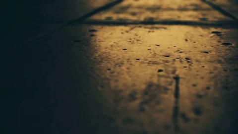 Passage of the camera through the old hard cover of the night street. An Stock Footage 93224138