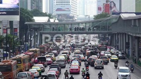 Passage crowded with people, cars traffic jam on street, the modern lifestyle Stock Photos