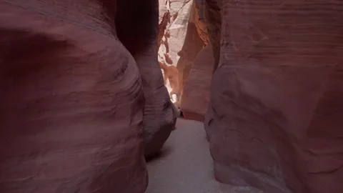 Passage inside canyon cliffs of Hiking Wire Pass on a summer day in Utah, USA Stock Footage 243598300