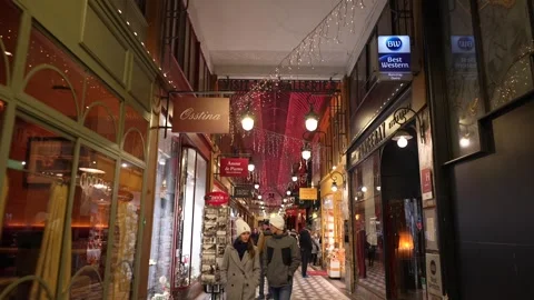 Passage Jouffroy Paris Dec 2 2023 with festive lights and decorated shop windows Stock Footage 314891941